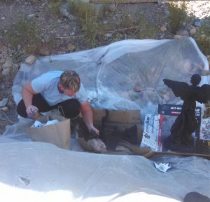 Spray painting creepy table decorations.